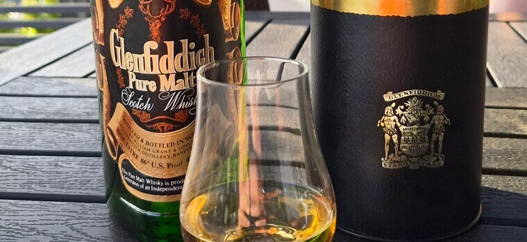 Glenfiddich Pure Malt whisky bottle and carton along with nosing glass